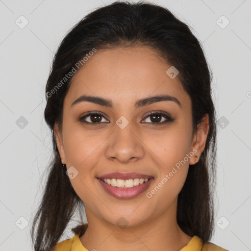 Joyful latino young-adult female with long  brown hair and brown eyes