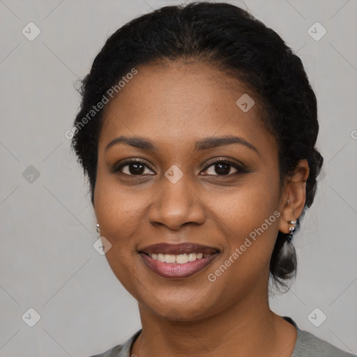 Joyful black young-adult female with medium  brown hair and brown eyes