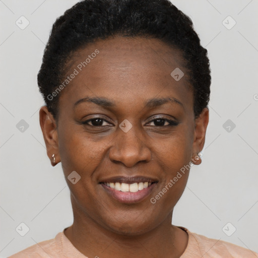 Joyful black young-adult female with short  brown hair and brown eyes