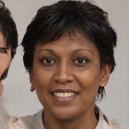 Joyful asian adult female with medium  brown hair and brown eyes