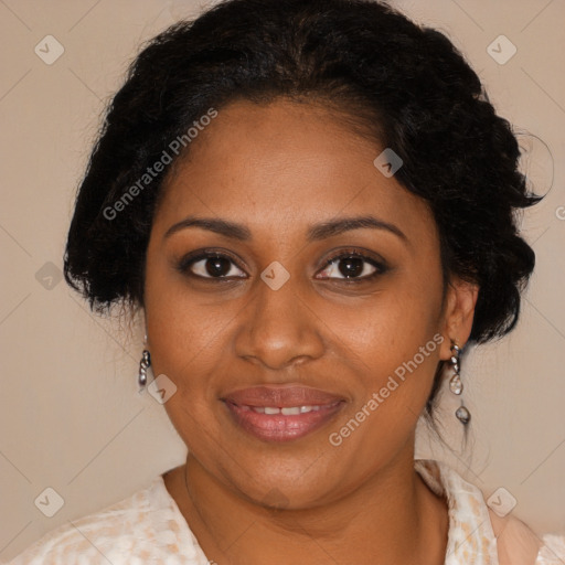 Joyful black adult female with medium  brown hair and brown eyes