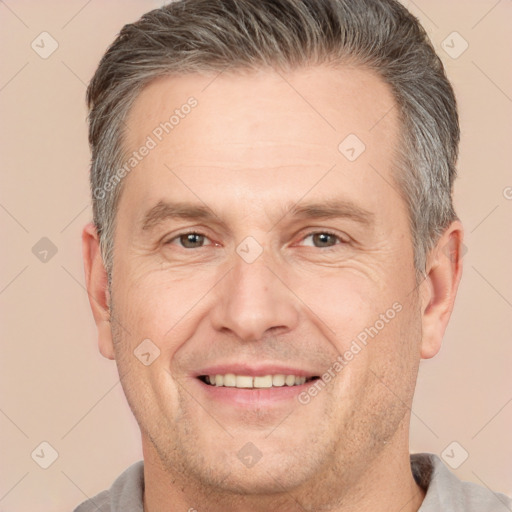 Joyful white adult male with short  brown hair and brown eyes