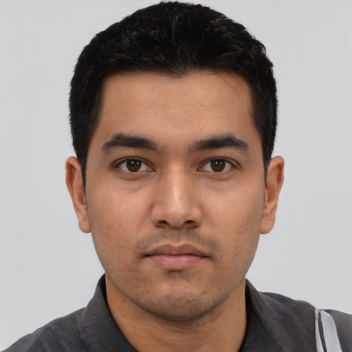 Neutral latino young-adult male with short  black hair and brown eyes
