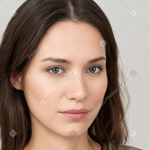 Neutral white young-adult female with long  brown hair and brown eyes