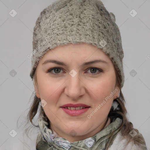 Joyful white young-adult female with medium  brown hair and blue eyes