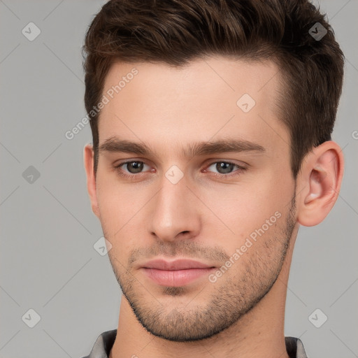 Neutral white young-adult male with short  brown hair and brown eyes