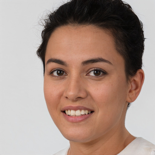 Joyful white young-adult female with short  brown hair and brown eyes