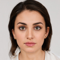 Neutral white young-adult female with medium  brown hair and brown eyes