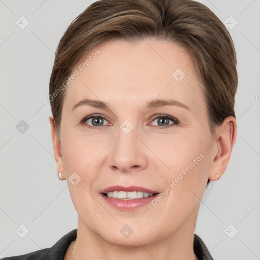 Joyful white adult female with short  brown hair and grey eyes