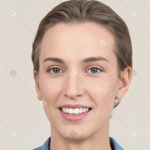 Joyful white young-adult female with short  brown hair and grey eyes