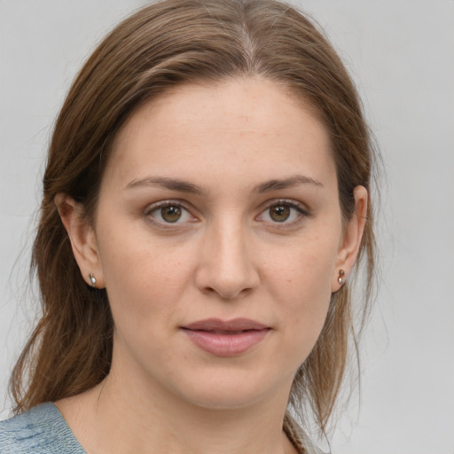 Joyful white young-adult female with medium  brown hair and grey eyes