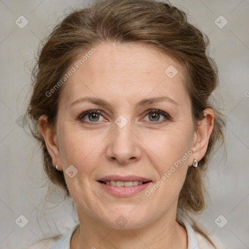 Joyful white adult female with medium  brown hair and grey eyes