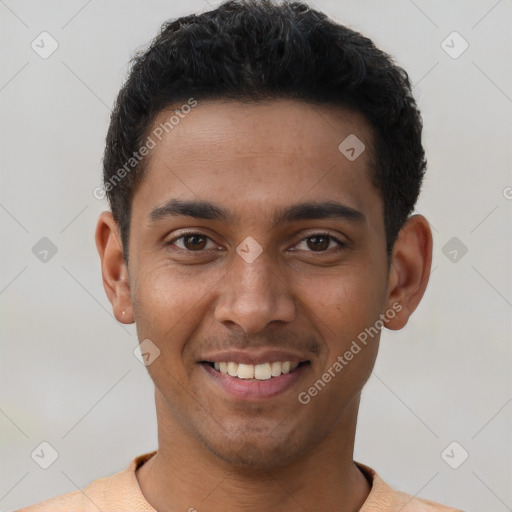 Joyful latino young-adult male with short  brown hair and brown eyes