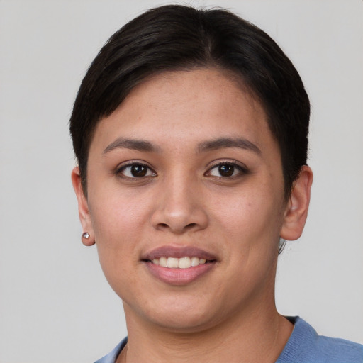 Joyful asian young-adult female with short  brown hair and brown eyes