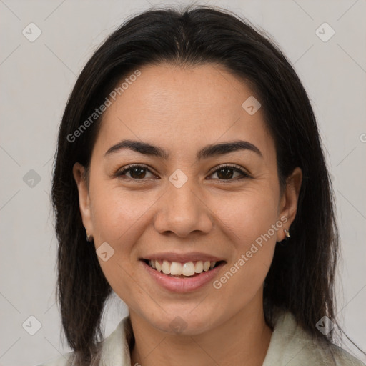 Joyful latino young-adult female with medium  brown hair and brown eyes