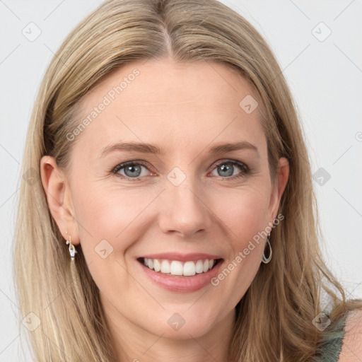 Joyful white young-adult female with long  brown hair and blue eyes