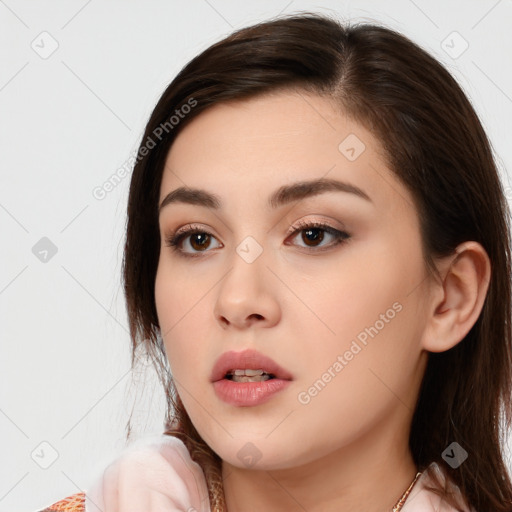 Neutral white young-adult female with long  brown hair and brown eyes