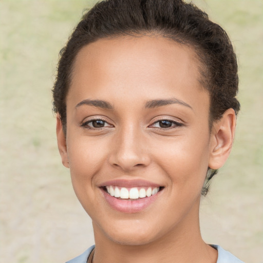 Joyful white young-adult female with short  brown hair and brown eyes