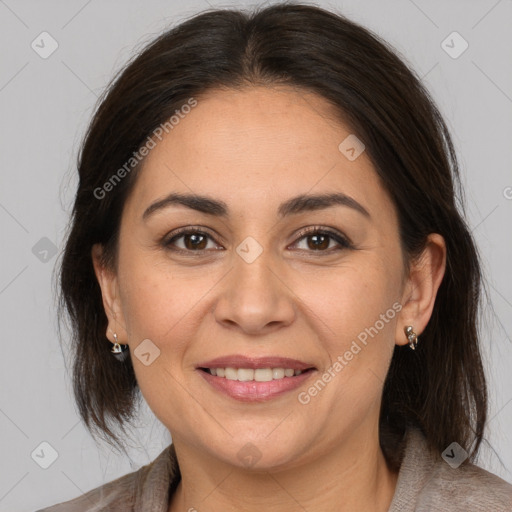 Joyful white adult female with medium  brown hair and brown eyes