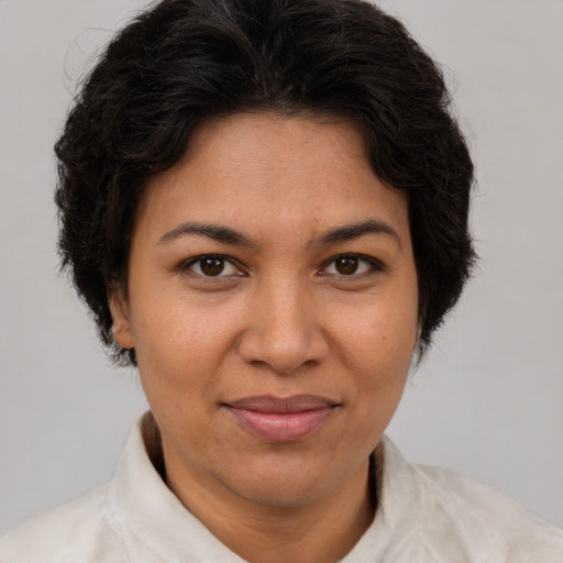 Joyful white adult female with short  brown hair and brown eyes