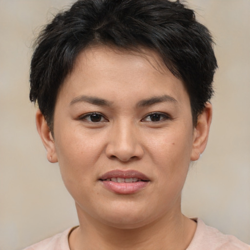 Joyful asian young-adult female with short  brown hair and brown eyes