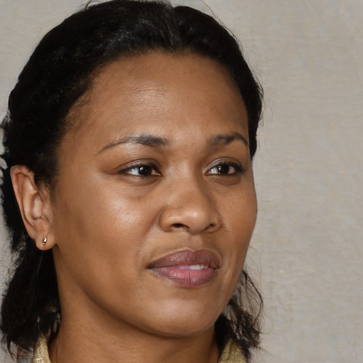 Joyful black young-adult female with medium  brown hair and brown eyes