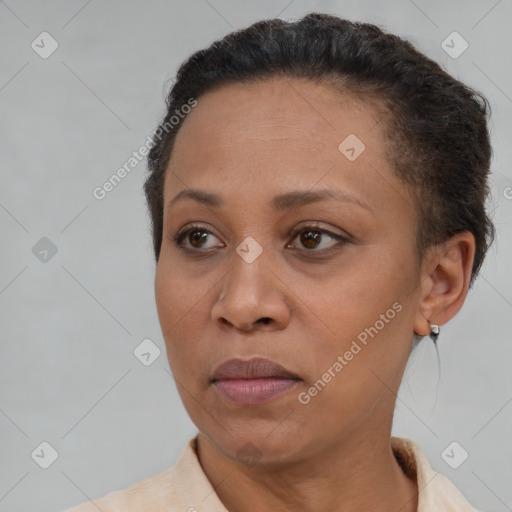 Joyful black adult female with short  brown hair and brown eyes