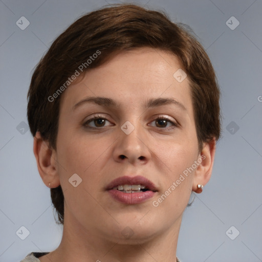 Joyful white young-adult female with short  brown hair and grey eyes