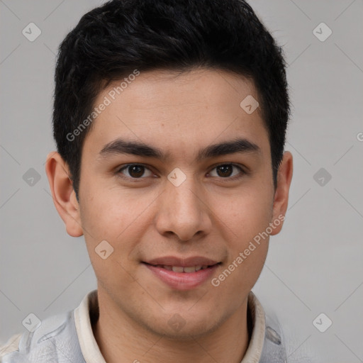 Joyful latino young-adult male with short  brown hair and brown eyes