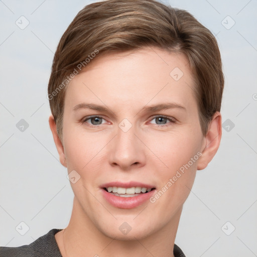 Joyful white young-adult female with short  brown hair and grey eyes