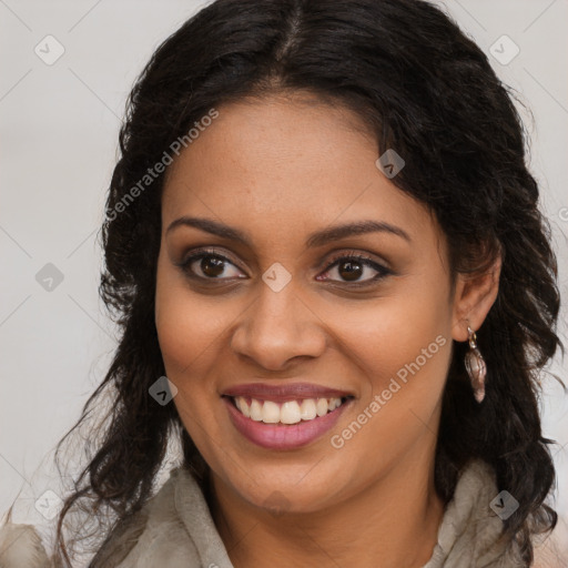 Joyful black young-adult female with long  brown hair and brown eyes