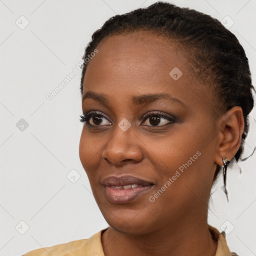 Joyful black young-adult female with short  brown hair and brown eyes