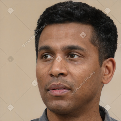 Neutral latino young-adult male with short  black hair and brown eyes