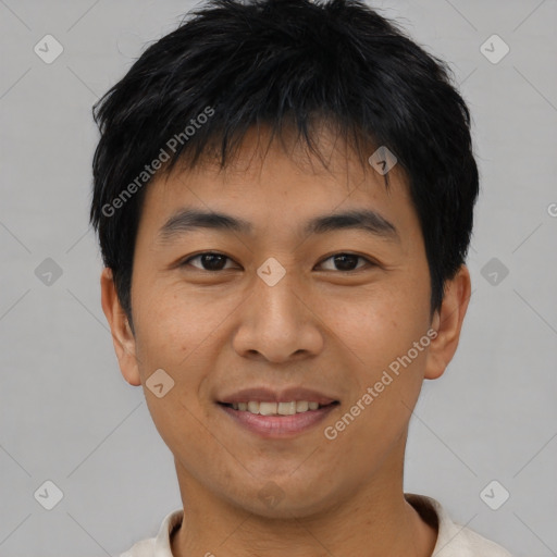 Joyful asian young-adult male with short  black hair and brown eyes