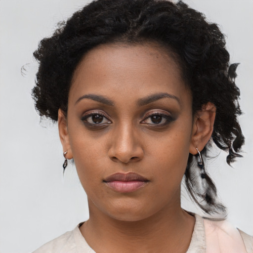 Neutral black young-adult female with short  brown hair and brown eyes