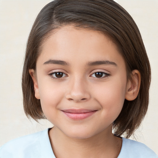 Joyful white child female with medium  brown hair and brown eyes