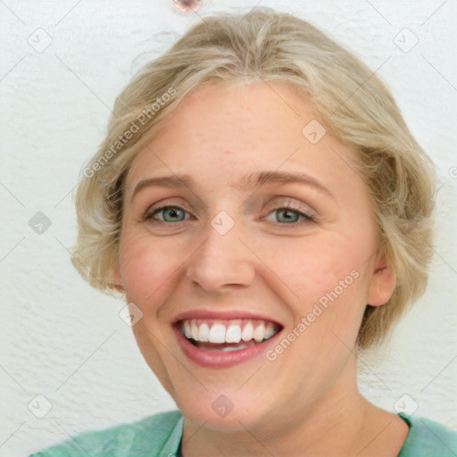 Joyful white adult female with medium  brown hair and blue eyes