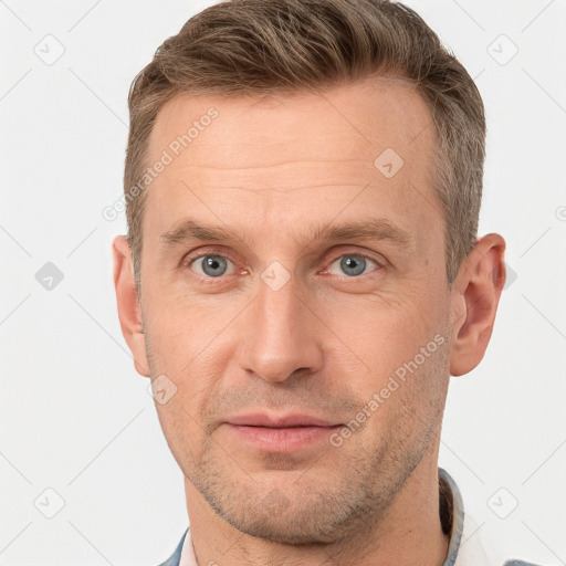 Joyful white adult male with short  brown hair and grey eyes