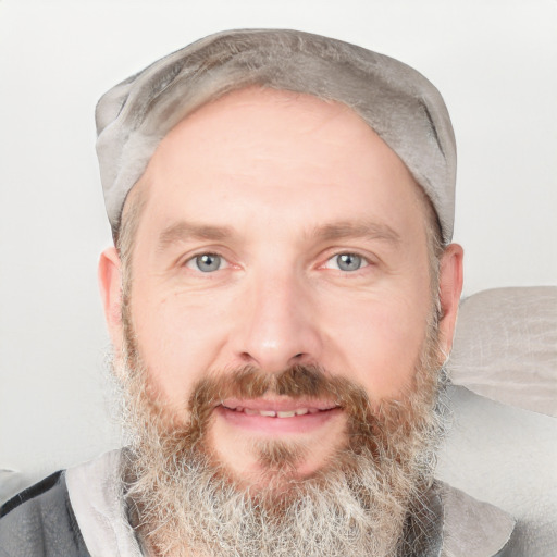 Joyful white adult male with short  brown hair and grey eyes