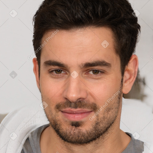 Joyful white young-adult male with short  brown hair and brown eyes