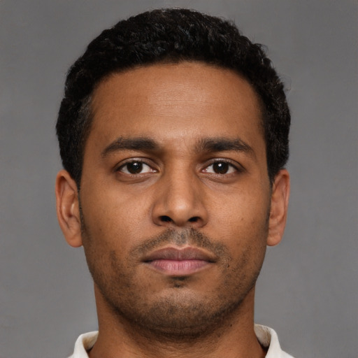Neutral black young-adult male with short  brown hair and brown eyes