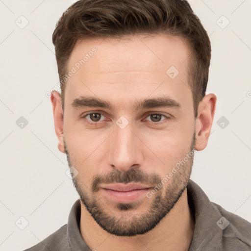 Neutral white young-adult male with short  brown hair and brown eyes