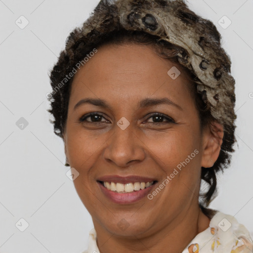 Joyful black adult female with short  brown hair and brown eyes