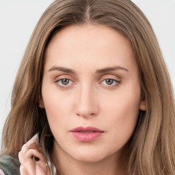 Neutral white young-adult female with long  brown hair and green eyes