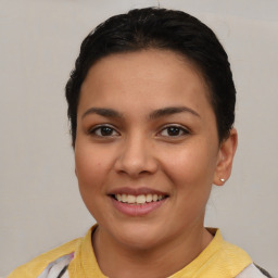 Joyful latino young-adult female with short  brown hair and brown eyes