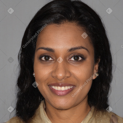 Joyful black young-adult female with long  black hair and brown eyes