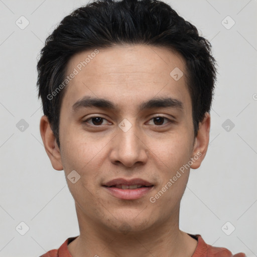 Joyful white young-adult male with short  black hair and brown eyes