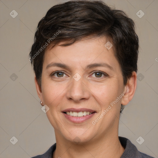 Joyful white adult female with short  brown hair and grey eyes
