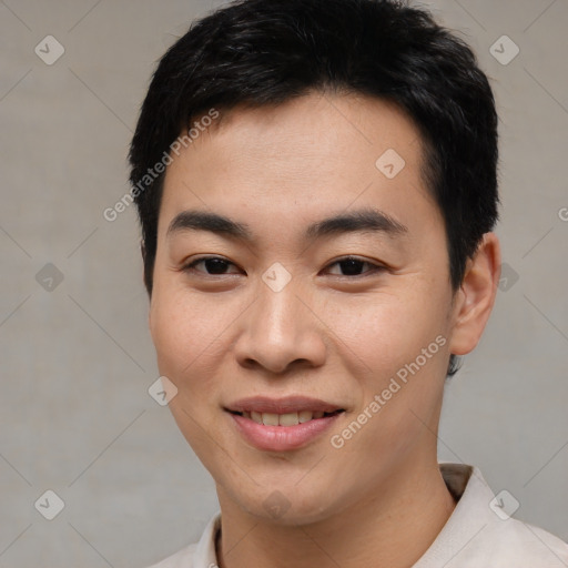 Joyful asian young-adult male with short  brown hair and brown eyes