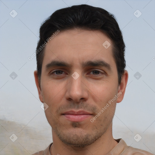 Joyful white young-adult male with short  black hair and brown eyes